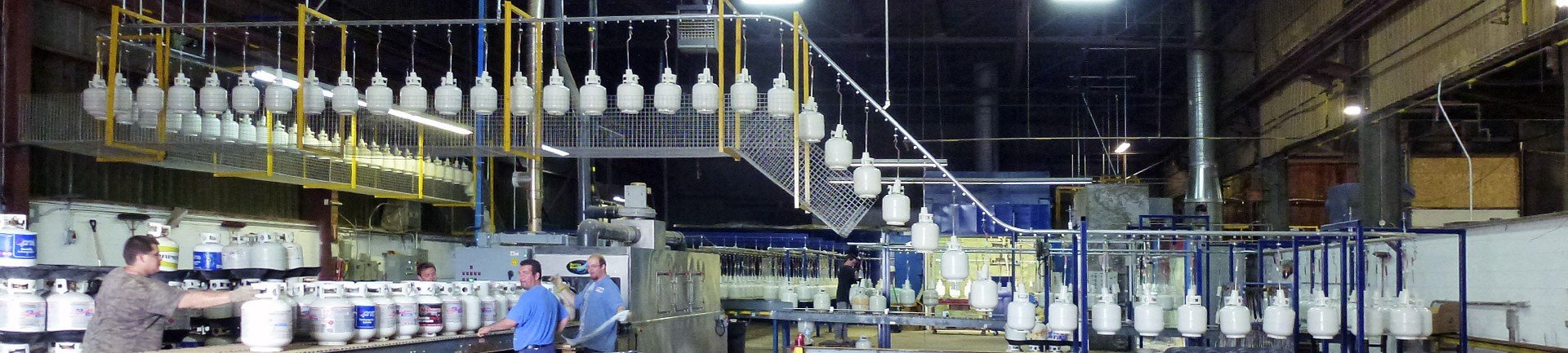 Enclosed track overhead conveyor for wet spray paint line Enclosed track conveyor for wet spray paint line