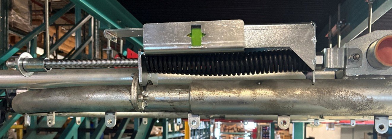 Pacline-Conveyor-Chain-Tension-Indicator-Green-Full Chain Tension Indicator window located on the take-up assembly expansion unit for the PAC-LINE™ enclosed track overhead conveyor system.