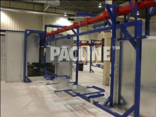 This PAC-MAX overhead monorail conveyor is set up to move carriers for large parts through a wet painting process.