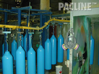 The PAC-LINE™ overhead conveyor for paint finishing of heavy gas bottles on rotating carriers.