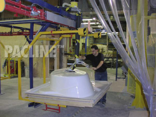 Unloading of bathtubs from S-310 power and free overhead conveyor system.