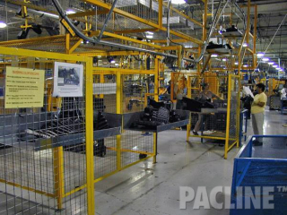 The PAC-LINE™ overhead conveyor system for automotive plastic scrap removal to grinding machines for recycling.