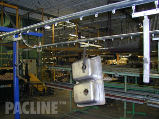 Transport of household sinks between processes using The PAC-LINE™ overhead conveyor system.
