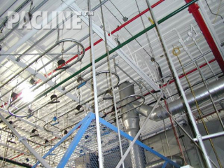 Transport and accumulation of automotive door seals between process using the PAC-LINE™ overhead conveyor.