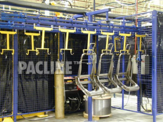 Automotive seats being accumulated while cooling, using power and free overhead conveyor system.