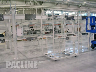 This view of an empty gravity flow conveyor reveals a mobile cart at one of the many docking stations.