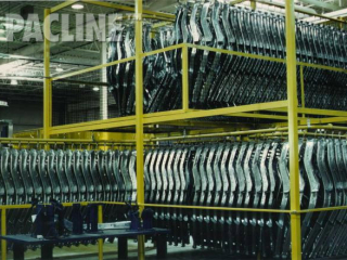 Enclosed track monorail conveyor system designed for parts accumulation to ensure efficient space utilization.