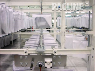 Gravity overhead conveyor flow rack with products accumulating.