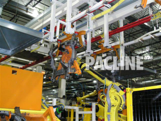 Cooling and transfer of engine cradles during welding process using power and free conveyor with robotic load and unload.