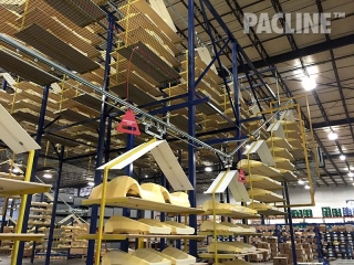 This overhead curing line utilizes both nylon mesh guarding as well as light duty wire mesh.