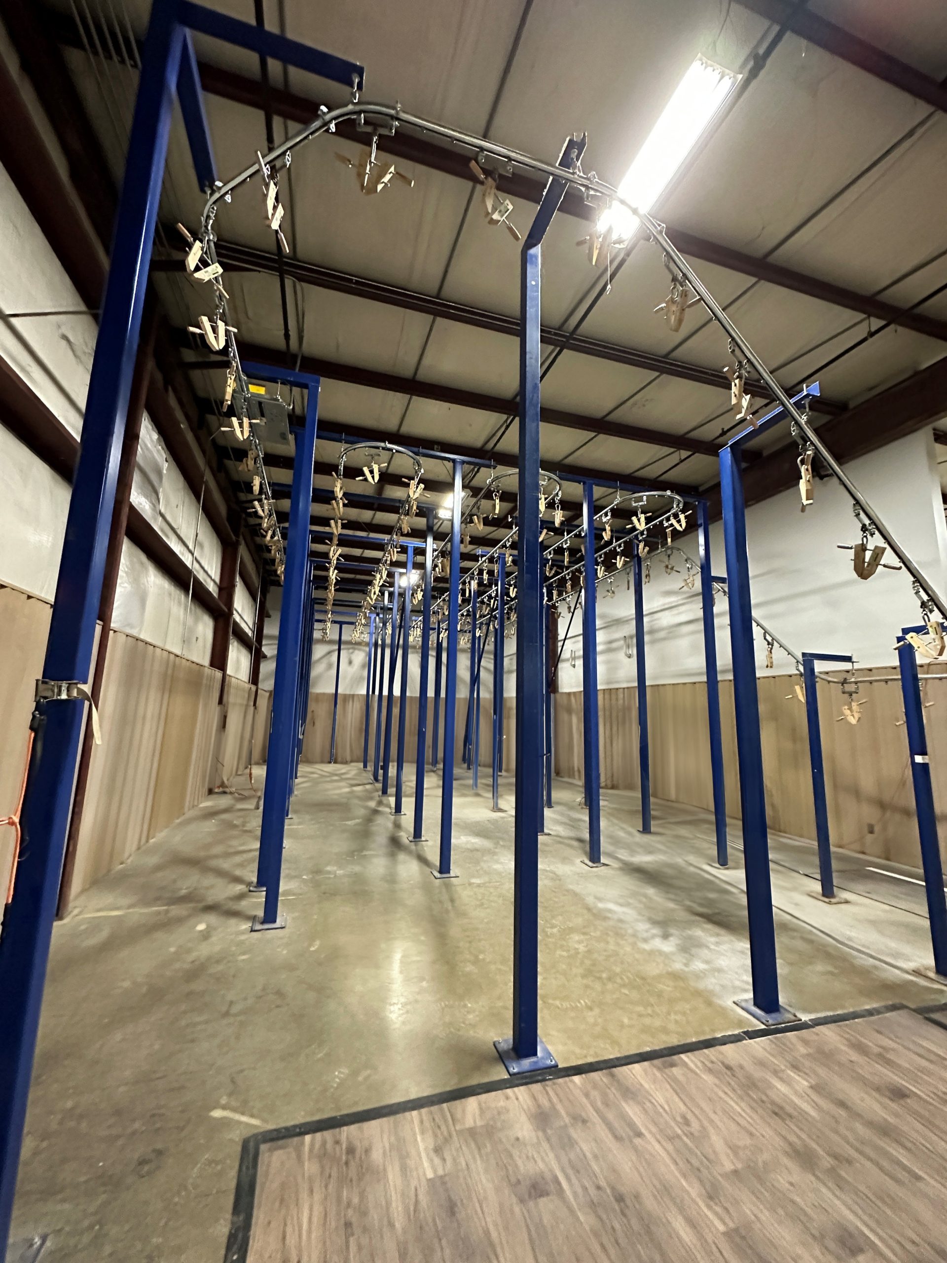 tent drying system using an overhead conveyor